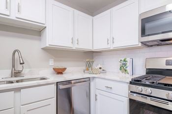 Kitchens with custom cabinetry and gleaming quartz countertops*